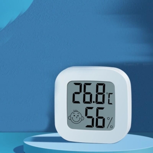 Thermomètre électronique pour chambre de bébé avec un fond bleu