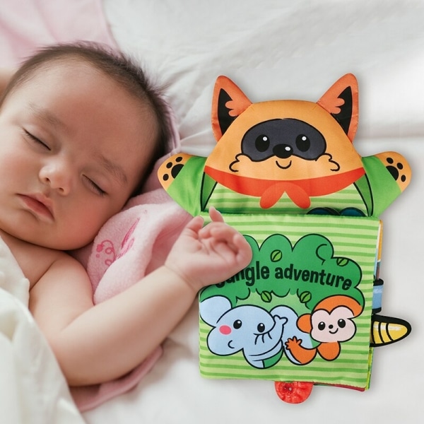 Livre en tissu avec marionnette avec un bébé qui dort à côté du livre