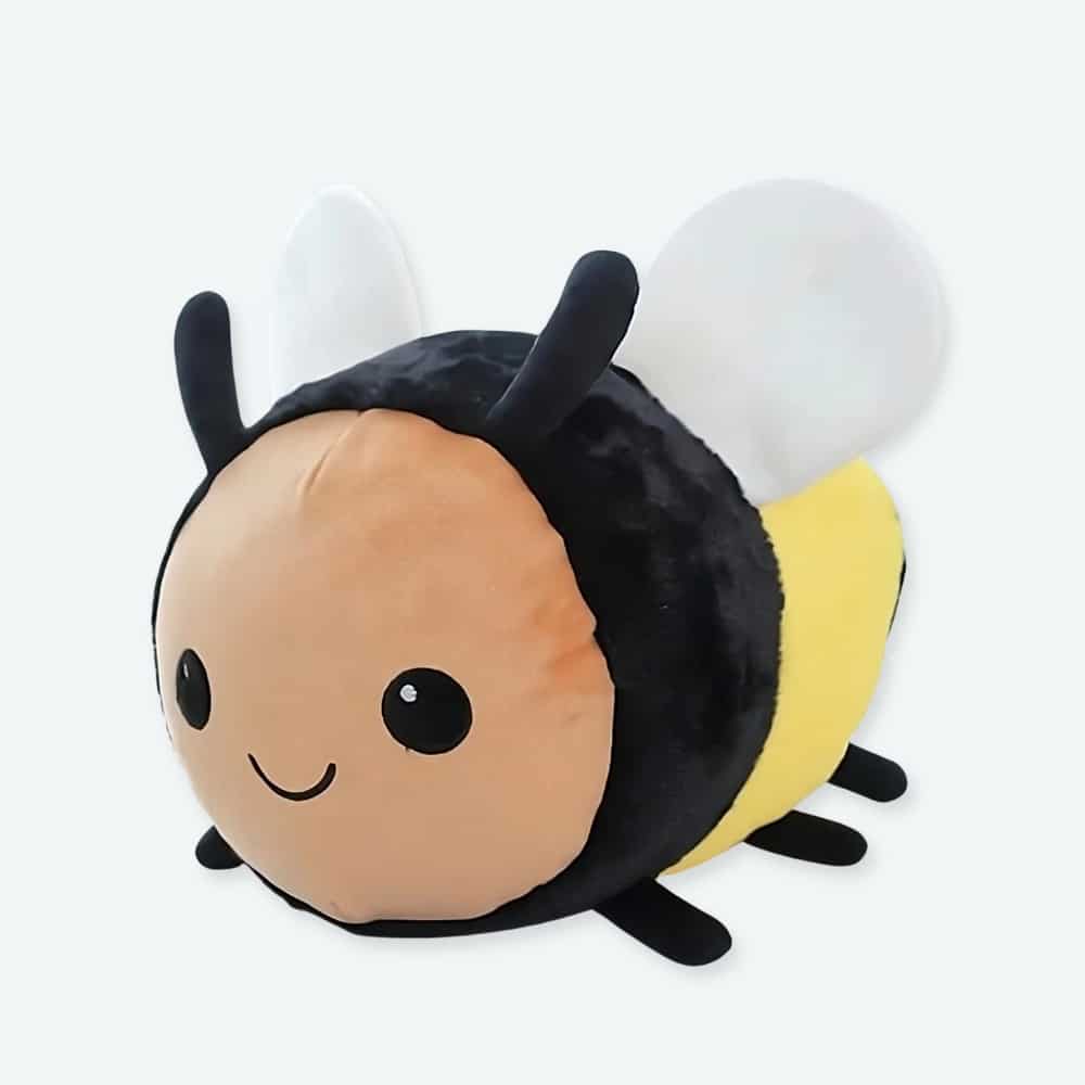 Peluche en forme d'abeille pour enfant, couleurs noir et jaune.