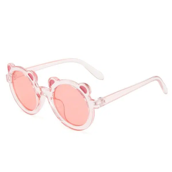 Lunettes de soleil en forme de tête d'ours pour bébé rose avec un fond blanc