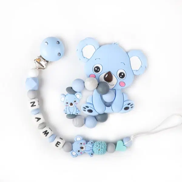 Bracelet de dentition pour bébé en forme de koala bleu avec un fond blanc