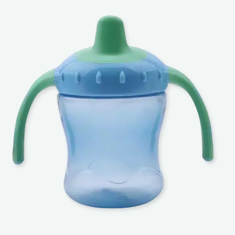 Biberon coloré de 260ml pour bébé un orange, un rose et un bleu avec un fond gris et une plante