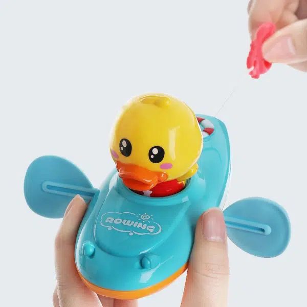 Jouets de bain classiques pour bébé un canard qui est dans un avion bleu avec un fond blanc