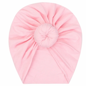 Bonnet donuts en coton rose avec un fond blanc