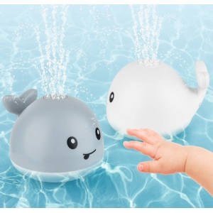 Jouet de bain lumineux en forme de baleine pour bébé deux jouets de bain un blanc et un gris avec un fond bleu